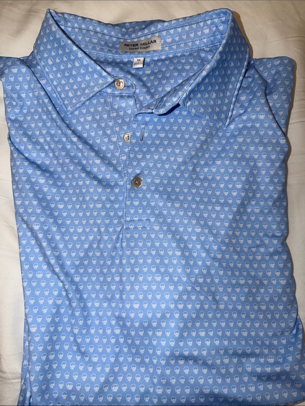 Peter Millar Blue Polo with Small White Skull Print